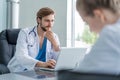 Medical Team Discussing Treatment Options With Patients. Team of doctors having a meeting in the meeting room. Royalty Free Stock Photo