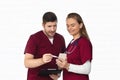 Medical team of doctor and nurse looking at phone consulting patient health online using internet mobile Royalty Free Stock Photo