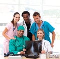 Medical team examining an X-ray and smiling Royalty Free Stock Photo