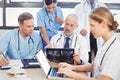 Medical team examining a x report Royalty Free Stock Photo