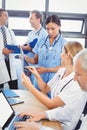 Medical team interacting in conference room Royalty Free Stock Photo