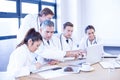 Medical team looking into laptop and having a discussion Royalty Free Stock Photo