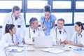 Medical team looking into laptop and having a discussion Royalty Free Stock Photo