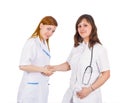 Medical team - a nurse and a doctor handshake