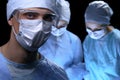 Medical team performing operation. Focus at female doctor Royalty Free Stock Photo