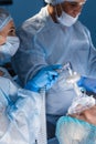 Medical Team Performing Surgical Operation in Bright Modern Operating Room Royalty Free Stock Photo