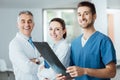 Medical team posing and examining an x-ray image Royalty Free Stock Photo