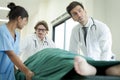 The medical team is rushing to bring the critically ill patient lying on the bed to request an emergency room or a dressing room Royalty Free Stock Photo