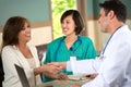 Medical team talking with patients.