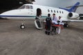 Medical team transfers a patient from an ambulance to a waiting air ambulance Royalty Free Stock Photo