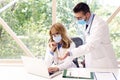 Medical team working together in the clinic while wearing face mask Royalty Free Stock Photo