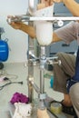 Medical technician make a new aluminium prosthesis legs for amputee patient