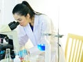 Medical technologist working with microscope Royalty Free Stock Photo