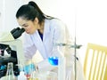 Medical technologist working with microscope