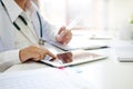 Medical Technology , Close up doctor reading a report in tablet.