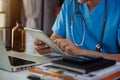 Medical technology concept. Doctor working with mobile phone and stethoscope and digital tablet.