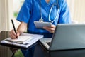 Medical technology concept. Doctor working with mobile phone and stethoscope in modern office Royalty Free Stock Photo