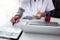 Medical technology concept. Doctor working on modern digital tablet and laptop computer Royalty Free Stock Photo