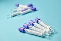 Medical test tubes with a test for coronavirus on blue background. Tests to determine the covid-19 virus. Royalty Free Stock Photo