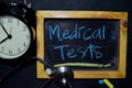 Medical Tests handwriting on chalkboard on top view Royalty Free Stock Photo