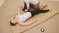 Medical thai massage - caucasian model female - stretch the muscles