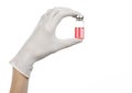 Medical theme: doctor's hand in a white glove holding a red vial of liquid for injection isolated on white background Royalty Free Stock Photo