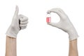 Medical theme: doctor's hand in a white glove holding a red vial of liquid for injection isolated on white background Royalty Free Stock Photo