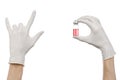 Medical theme: doctor's hand in a white glove holding a red vial of liquid for injection isolated on white background Royalty Free Stock Photo