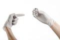 Medical theme: doctor's hand in a white glove holding a vial of clear liquid for injection isolated on white background Royalty Free Stock Photo