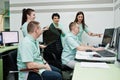 Medical theme.Observation room with a computer tomograph. The group of doctors meeting in the mri office at diagnostic center in Royalty Free Stock Photo