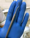 A medical tool in the hands of a dentist