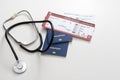 Medical tourism concept. Stethoscope with passport. Royalty Free Stock Photo