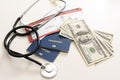 Medical tourism concept. Stethoscope with passport and dollar bills. Royalty Free Stock Photo