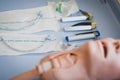 Medical training - intubation of a child sized manikin using an endotracheal tube and video laryngoscopes.