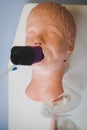 Medical training - intubation of a child sized manikin using an endotracheal tube and video laryngoscopes. Royalty Free Stock Photo