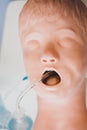 Medical training - intubation of a child sized manikin using an endotracheal tube and video laryngoscopes.