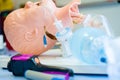 Medical training - intubation of a child sized manikin using an endotracheal tube and video laryngoscopes.