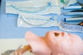 Medical training - intubation of a child sized manikin using an endotracheal tube and video laryngoscopes. Royalty Free Stock Photo