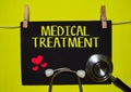 MEDICAL TREATMENT on top of yellow background. Royalty Free Stock Photo