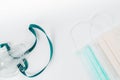 Medical ultrasonic inhaler or nebulizer oxygen mask and hygienic face masks on white background
