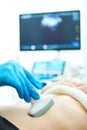 Medical ultrasound imaging and scan. Examining stomach of female patient Royalty Free Stock Photo