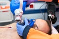 Medical urgency in the ambulance. Cardiopulmonary resuscitation using hand valve mask bag Royalty Free Stock Photo
