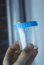Urine sample test cup Royalty Free Stock Photo