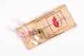 Medical venflon placed in a mousetrap. Medical accessories as a trap for patients Royalty Free Stock Photo