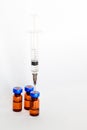 Medical vials, ampules for injection with a syringe on a white background Royalty Free Stock Photo