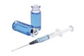 Medical vials with blue vaccine and syringe on white background