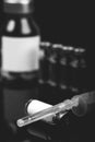 Medical vials for injection with a syringe and ampules, black and white photo Royalty Free Stock Photo