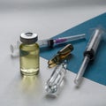 Medical vials for injection with a syringe and ampules on light background Royalty Free Stock Photo