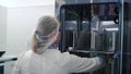 Medical Virology Research Scientist Works with Mask. Clip. Scientist Takes out Test Tubes from Refrigerator. She Works