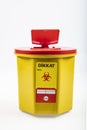 Medical waste bin 1,3 liter. Yellow biohazard medical contaminated clinical waste container isolated on white background Royalty Free Stock Photo